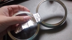 Wrap aluminum foil to cover the tape